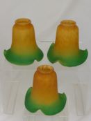 Three Art Deco Style Glass Lamp Shades, the shades are mustard yellow with delicate green edging. (