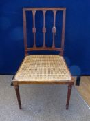 An Edwardian Cane Seated Bedroom Chair with turned legs and gate back.