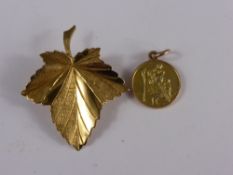 9 ct Gold Hallmark Brooch, in the form of a vine leaf together with a yellow and rose gold St