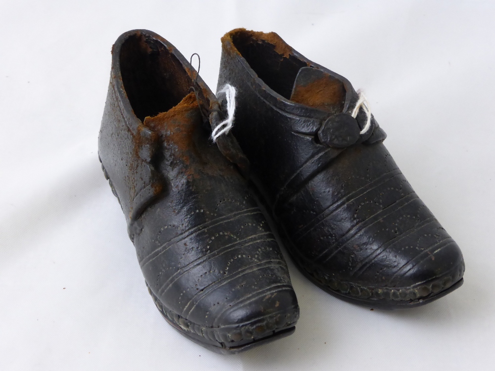 A Pair of 19th Century Miniature Child`s Leather Hobnail Clogs, the clogs hand stitched with