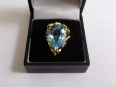 A Lady`s 14 ct 14 K Blue Topaz and Diamond Ring, centre stone 18 x 13 mm, the tear shaped stone set