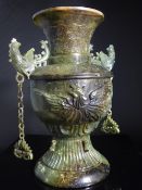 An Antique Chinese Jade Urn, crafted in baluster form having ornately carved phoenixes in flight to