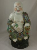 A Large Famille Rose Buddhist Figure, depicted seated in a contemplative pose, approx 556 x 36 cms.