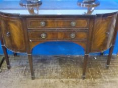A Flame Mahogany Break Front Sideboard, with two central drawers with cupboards on either side,