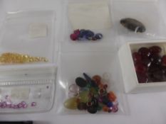 A Collection of Miscellaneous Semi Precious Gemstones including sapphires, synthetic sapphires and