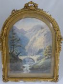 An arch framed late 19th century watercolour depicting an alpine gorge scene, the frame being