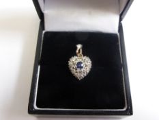 A 9 ct Gold and Silver Sapphire and Diamond Heart Shaped Locket, saph 2.9 x 3 mm 24 rose cuts dias,