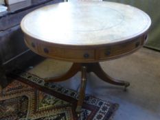 A Reproduction Library Drum Table, with tooled leather insert with splayed feet, est. diameter 113