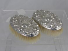 Two Solid Silver Hair Brushes, together with a three piece dressing table set, Birmingham hallmark,