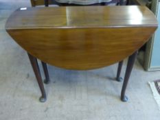 A Victorian mahogany oval drop leaf table on pad feet, est. 88 x 90 x 72 cms.