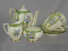 Royal Doulton Part Tea Set, `Iris Pattern`, comprising tea pot, milk jug, sugar bowl, two tea cups