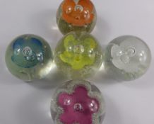 Five Caithness `Morning Dew` Paperweights, including white, yellow, pink, blue and orange.