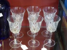 A set of six lead crystal wine glasses.