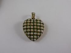 A 9 ct Yellow Gold, Seed Pearl and Emerald Heart Shaped Locket, 22 x 22 mm, 6.3 gms.