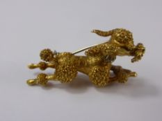 An 18 ct Yellow Gold Hand Crafted Poodle Brooch, the brooch depicting a Poodle in full stride