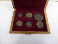 A Hand Made Olive Wood Box containing six miscellaneous genuine Roman coins of various