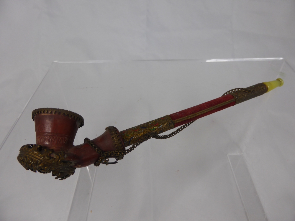 A 19th Century Turkish/Ottoman Topane Pipe, having a jade style mouth piece with clay pipe bowl