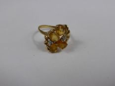 A Lady`s 10 ct Gold Yellow Stone and Diamond Ring Size O, wt approx 2.4 gms.