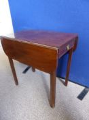 An Edwardian mahogany Pembroke table fitted with a single drawer, dummy drawer front to the other