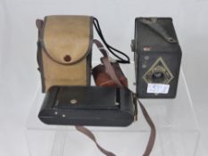 Three Vintage Cameras, including a Kodak Junior 6-20, a box Ensign and a Kodak Duaflex in a Khaki