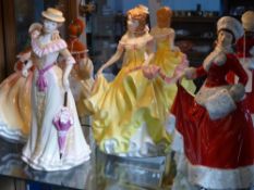 Four Royal Doulton crinoline `Pretty Lady` series figurines, including Winter H5314, Autumn HN5323,