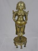 An antique Indian brass figure of a lady carrying a bowl with birds on her shoulders, the figure