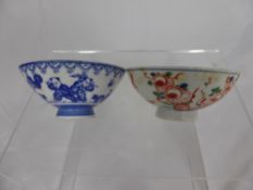 An Antique Chinese Tea Bowl, hand painted with birds and flowers together with an antique blue and