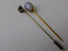 A 9ct Gold Hallmark and Opal Tie Stick, together with another tie pin with a white stone. (2)