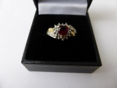 A Lady`s 9 ct Hallmark Diamond and Red Heart Shape Stone Ring, size N, approx wt 2.5 gms.