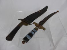 Two Antique Middle Eastern Daggers, both with curved blades, the first dagger with decorative