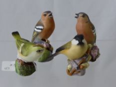 Four Royal Worcester Figures of Birds comprising two chaffinches, a gold crest and a marsh tit (4)