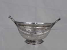 An antique Indian silver boat shaped bowl having a pierced rim with fine vine leaf engraving to the