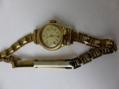 A Lady`s 9 ct Gold Spolkace Wrist Watch on rolled gold bracelet.