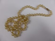 A Set of Simulated Pearls on 9 ct Gold Clasp.