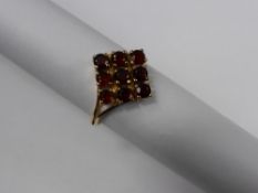 A Ladies 9 ct Yellow Gold and Garnet Cluster Ring, garn 9 x 3 mm, est wt 3.4 gms.