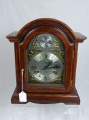 A Mid 20th Century Bracket Clock, in mahogany veneer case of architectural design, 30 day movement