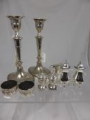 A pair of Silver Plate candlesticks, height 215 mm together with a pair of silver salt cellars mm R