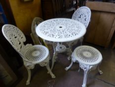 A set of ornate white painted metal garden furniture comprising a circular table ( approx. diameter