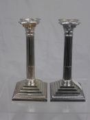 A set of four antique silver plated Corinthian column candlesticks, approx. 23 cms. in height. (4)