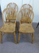 A set of four antique pine kitchen chairs being spindled backed and stamped 1940 Ecomme (4)