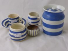 A Quantity of Cornish Ware, including a biscuit barrel, milk jug, sugar bowls, cereal bowl, mug and