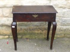 A Victorian dark oak hall table, the legs being slightly cabriole shaped, approx. 70 x 38 x 70 cms.