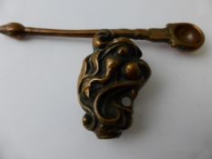 An Antique Copper Figure of a Stylised Lion`s Head, possibly a cane top together with an antique