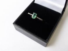 A Green and White Stone Ring, 9ct hallmark (10k), approx