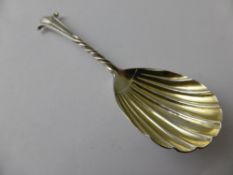A Victorian Solid Silver Caddy Spoon, the spoon having a twisted stem and shell shaped bowl. London