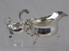 A Solid Silver Gravy Boat, with roped edge and supported on hoof feet, m.m S Blanckensee & Sons