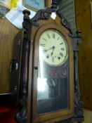 A Mahogany and Oak Cased Wall Clock, 8 day chiming movement with white enamel face and Roman