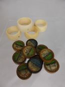 Five antique ivory napkin rings together with ten board game counters depicting WW I naval vessels.