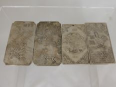 Four Chinese silver metal ingots, the first depicting an elephant and a Chinese horoscope, the