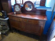 A Victorian mahogany bow fronted sideboard having two drawers and two cupboards below, the top and